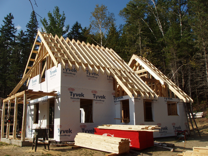 roof rafters nearly complete over the main cottage